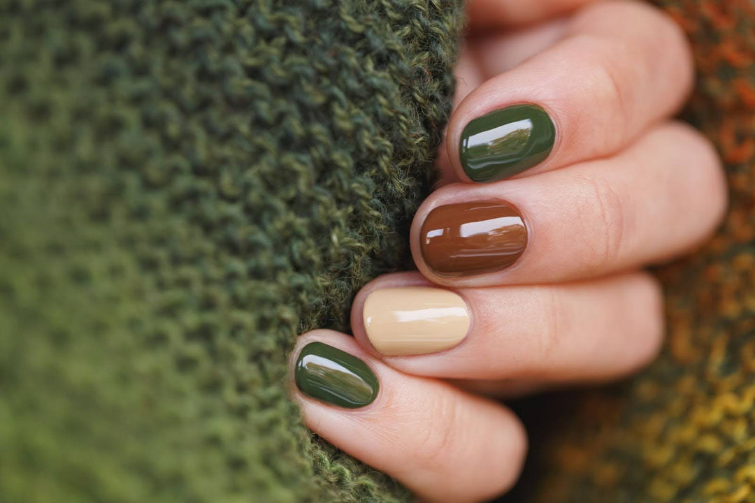 female hands with trendy fall nails manicure