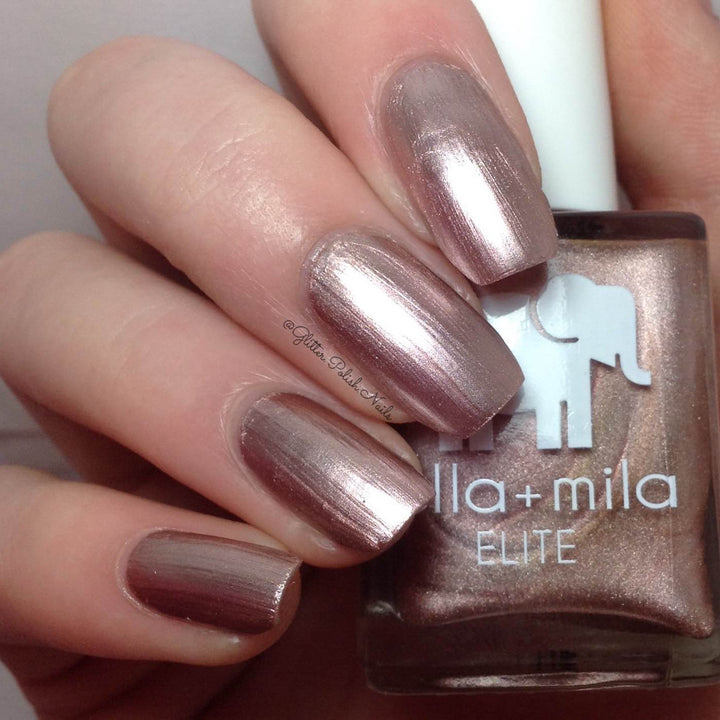 Champagne Pop metallic rose gold nail polish close-up with the bottle