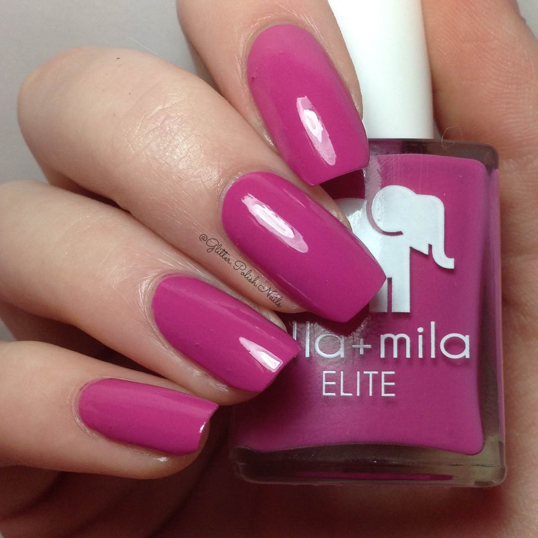 Summer Roam-ance berry dark pink nail polish close-up with the bottle