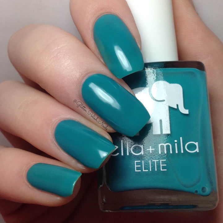 One Way Ticket summertime teal nail polish close-up with the bottle