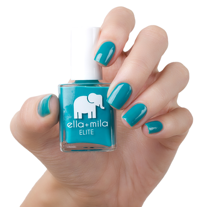 One Way Ticket teal nail polish manicure on a light skin tone with the bottle