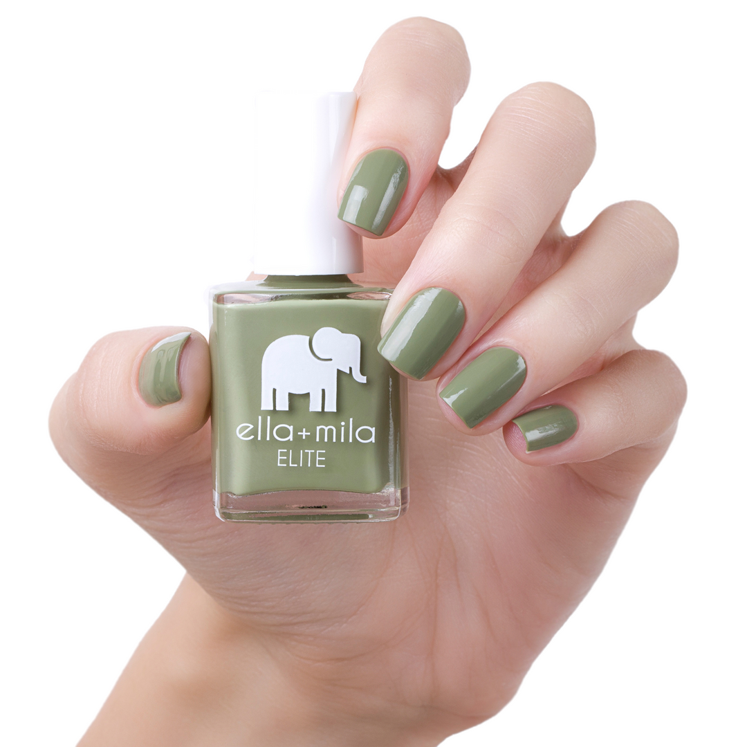 Paradise Isle army green nail polish manicure on a light skin tone with the bottle