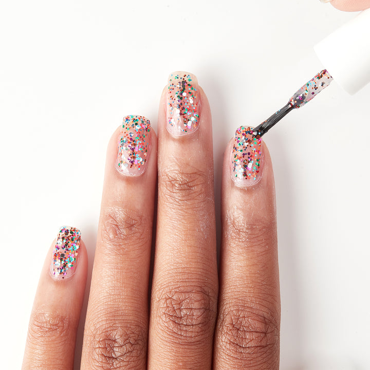 Applying Party in a Bottle multicolor glitter nail polish