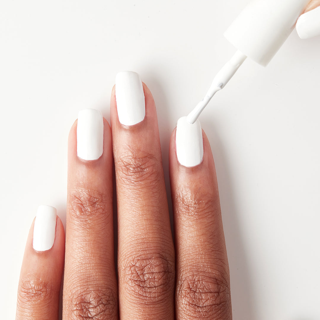 Applying Pure Love white nail polish