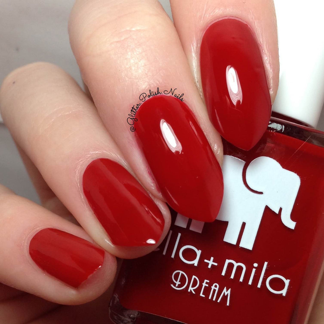 Unwrap Me festive pure red nail polish close-up with the bottle