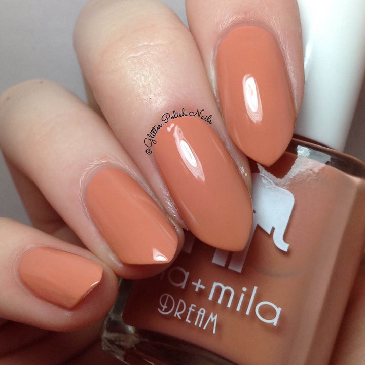 A La Nude soft burnt-orange brown nail polish close-up with the bottle