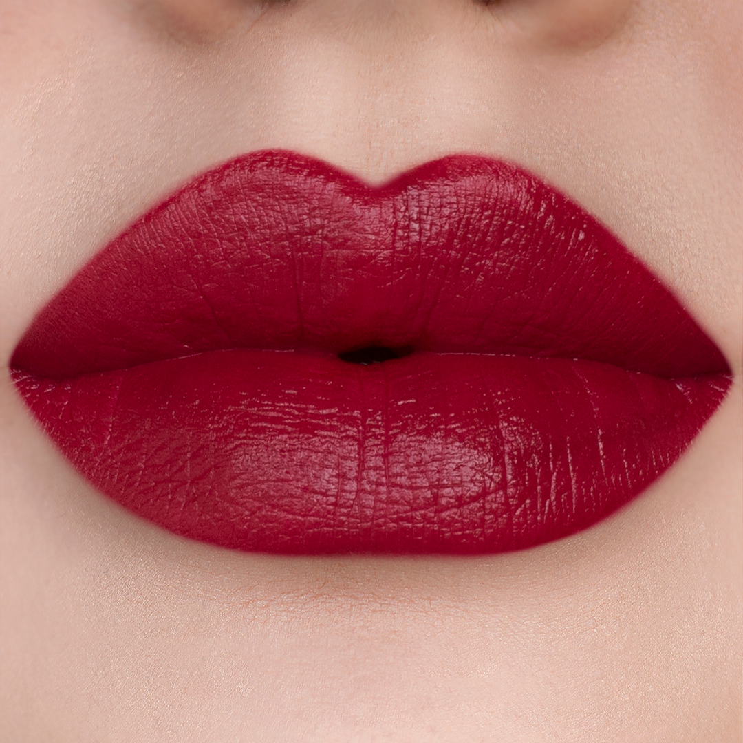 After 5 deep cherry red lipstick on lips, light skin tone