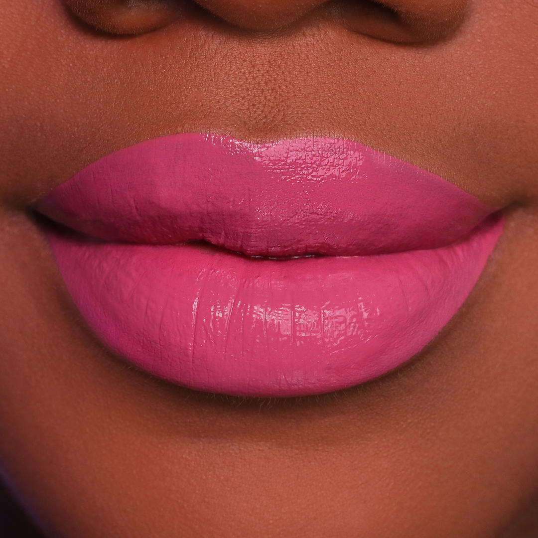 Blush rosy pink lipstick on lips, medium-deep skin tone