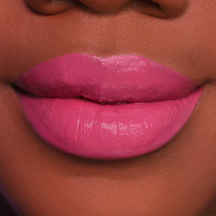 Blush rosy pink lipstick on lips, medium-deep skin tone