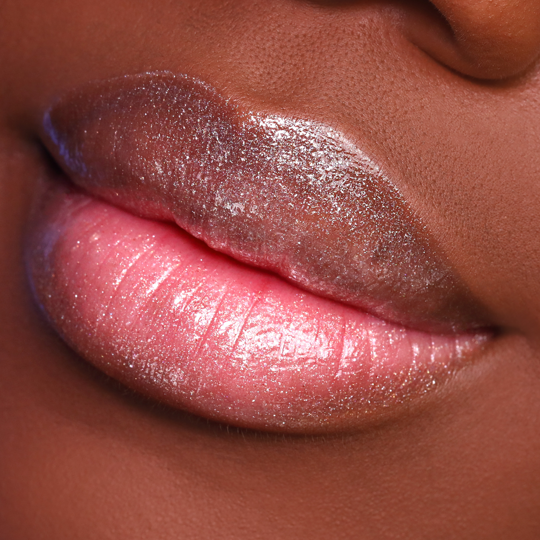 Get the Glow shimmer lip gloss on lips, deep skin tone close-up