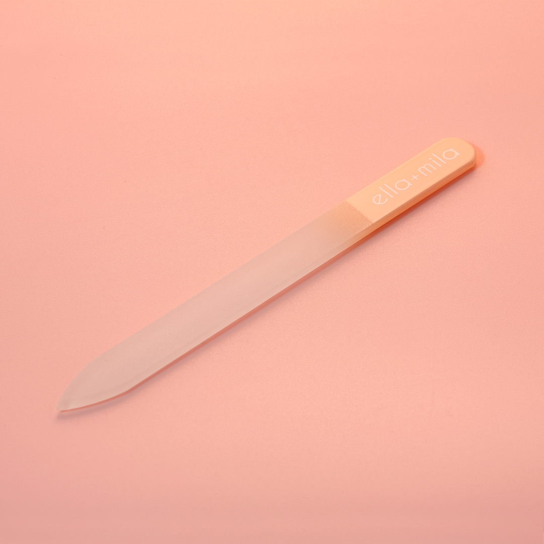 Peach ombre glass nail file on a peach background