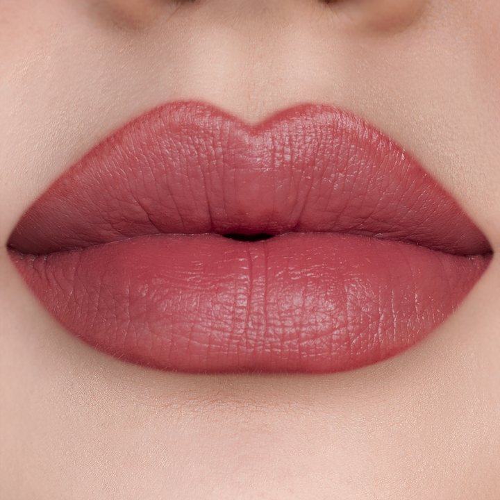 Just Right rosewood lipstick on lips, light skin tone