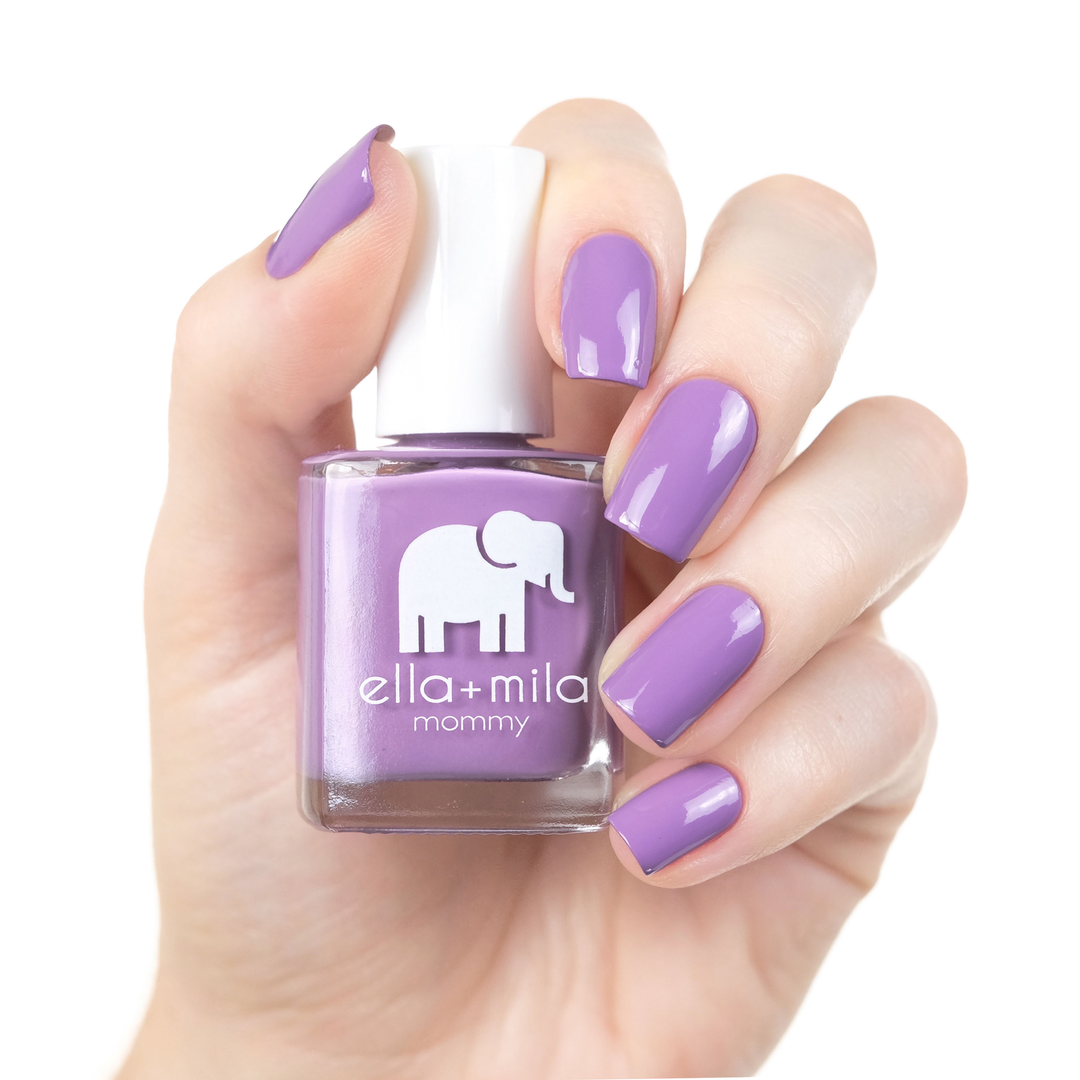 Lavender Fields spring purple nail polish manicure on a light skin tone with the bottle