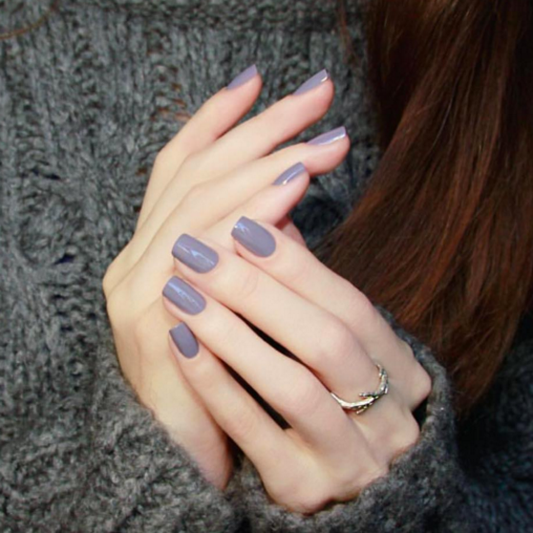 Mauve Over muted mauve nail polish manicure with a grey knit sweater