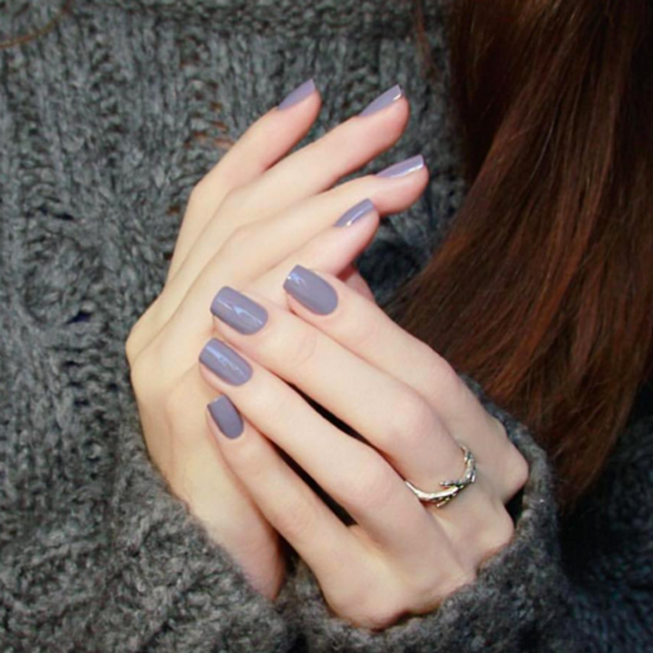 Mauve Over muted mauve nail polish manicure with a grey knit sweater