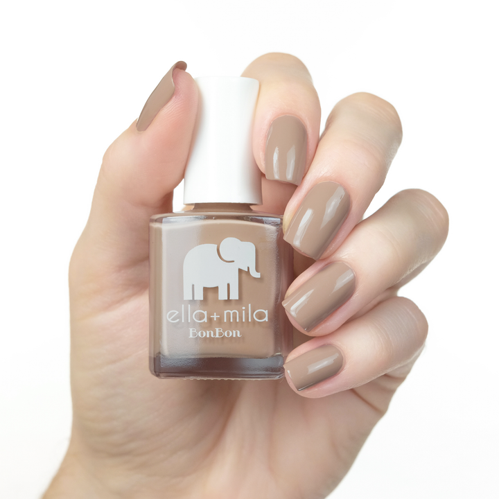 Mocha Dreams neutral brown nail polish manicure on a light skin tone with the bottle
