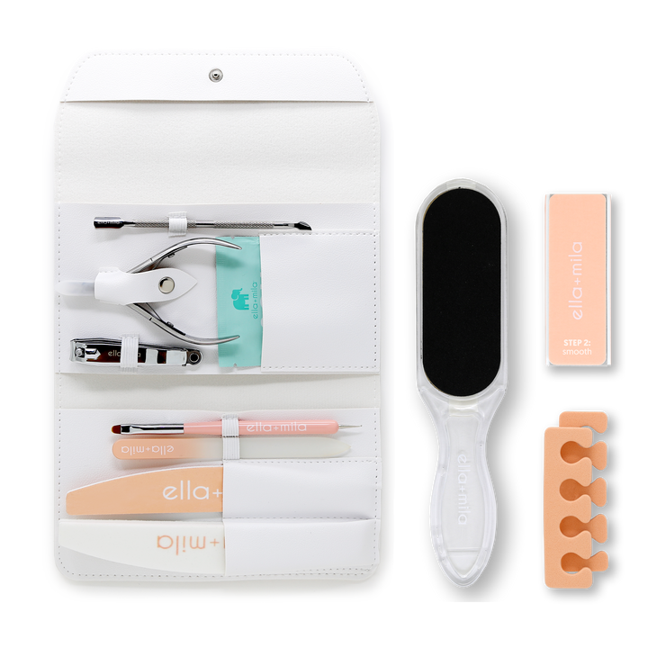 Manicure Tool Kit unrolled with all tools, foot file, buffer and toe separator