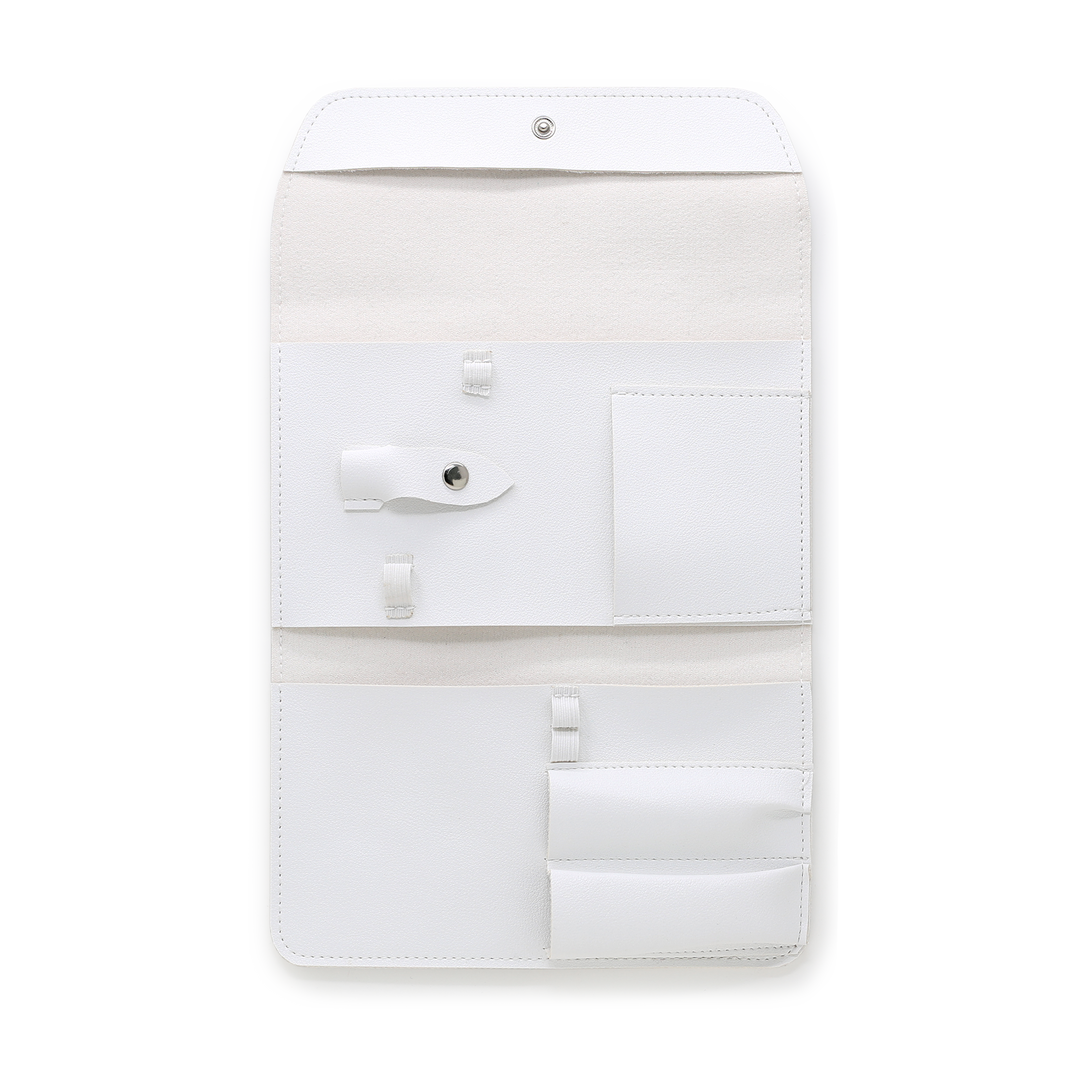 White manicure tool case open showing empty tool pockets and pouch