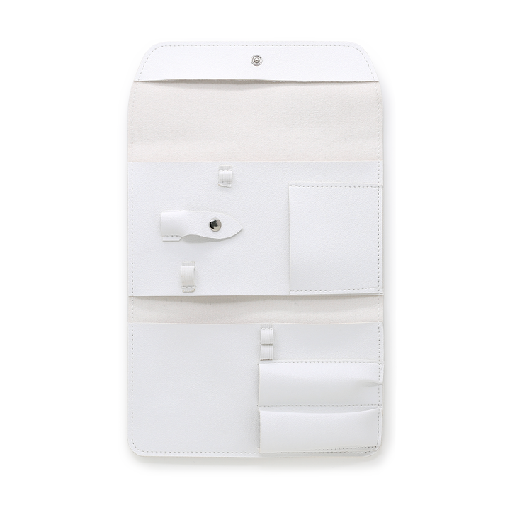 White manicure tool case open showing empty tool pockets and pouch