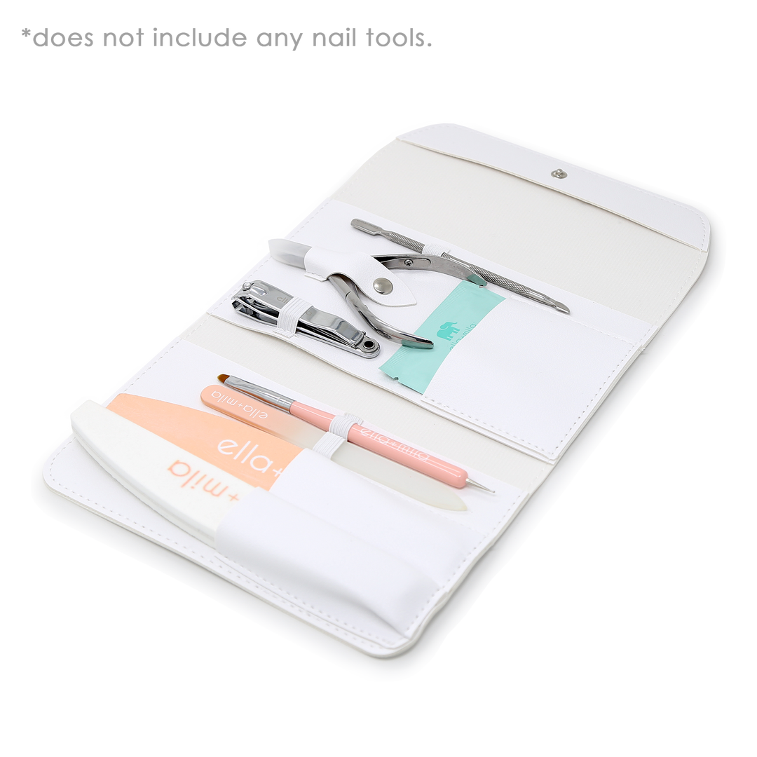 White manicure tool case open with nail tools, files and buffer displayed