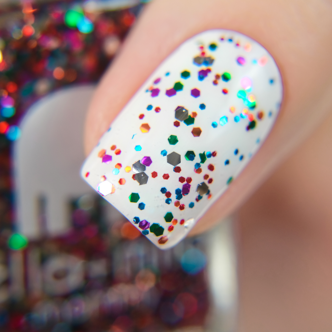 Party in a Bottle rainbow glitter nail polish close-up over white