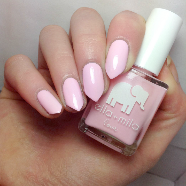 Pink Me Up baby pink nail polish close-up with the bottle