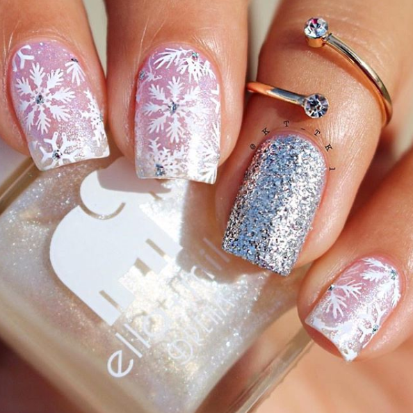 Pixie Dust shimmer nail polish with snowflake and silver glitter accent nail art