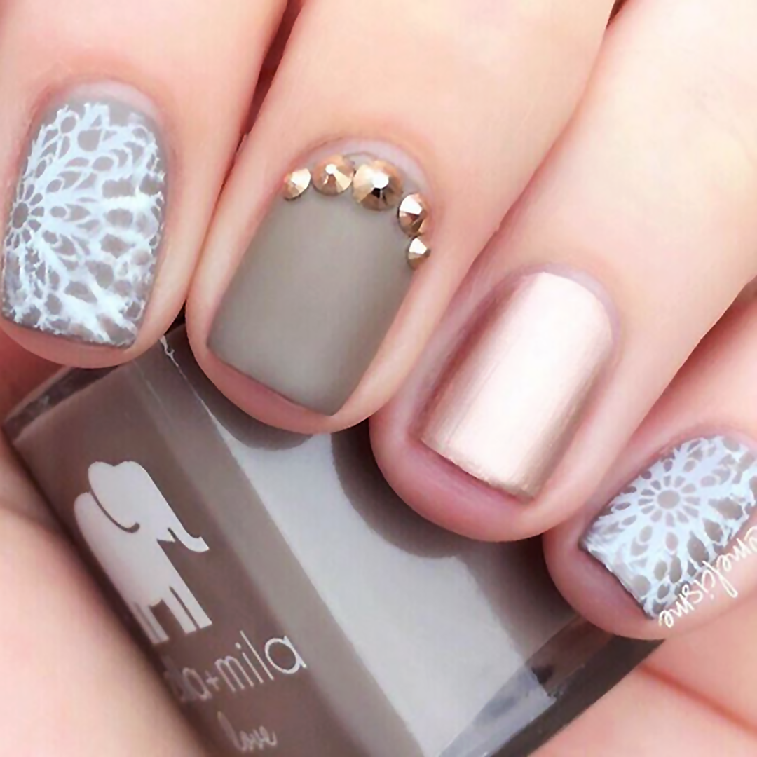 Sandstorm taupe nail polish with lace pattern and gold stud accent nail art