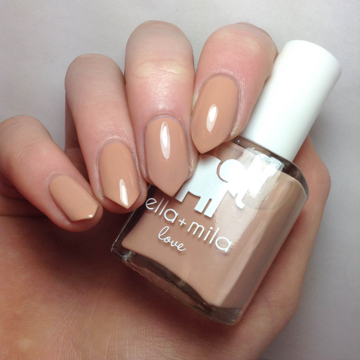 Sandy Toes nude caramel nail polish close-up with the bottle