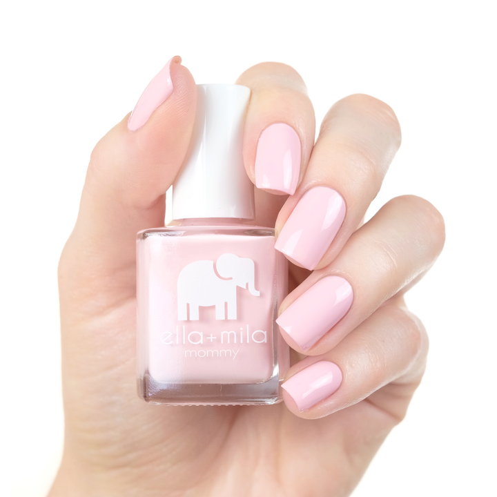 So in Love pastel pink nail polish manicure on a light skin tone with the bottle