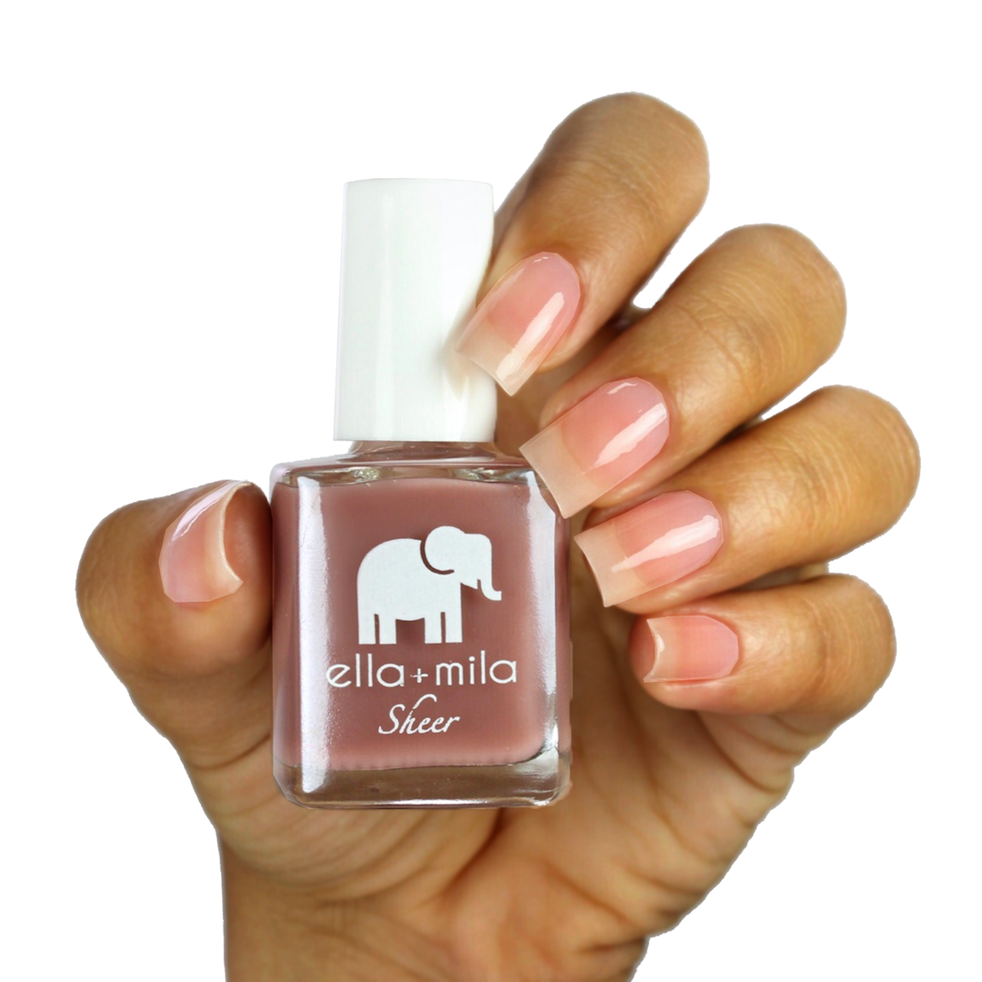 Strong sheer brown mauve nail polish on a medium skin tone, hand holding the bottle