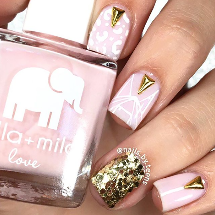 Stuck On You pink nail polish with gold glitter and stud accent nail art