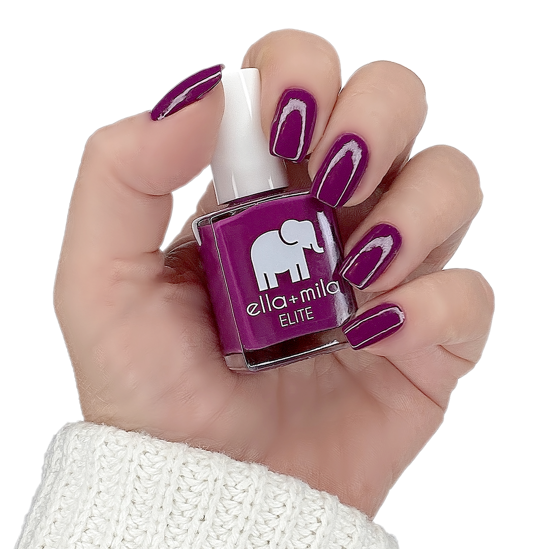 Take Off mauve berry pink nail polish manicure on a light skin tone with the bottle