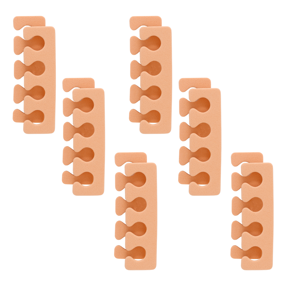 Six peach foam toe separators arranged on a white background