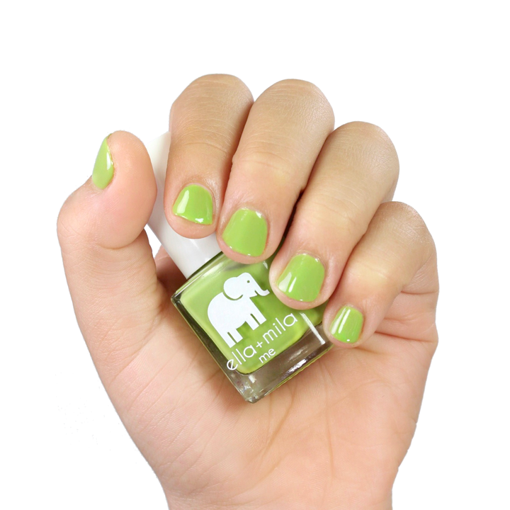 Tropical Jungle clover green nail polish manicure on a light skin tone with the bottle