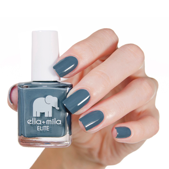 Yacht Club grey-blue nail polish manicure on a light skin tone with the bottle