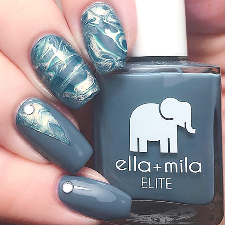 Yacht Club grey-blue nail polish with blue marble and gold accent nail art